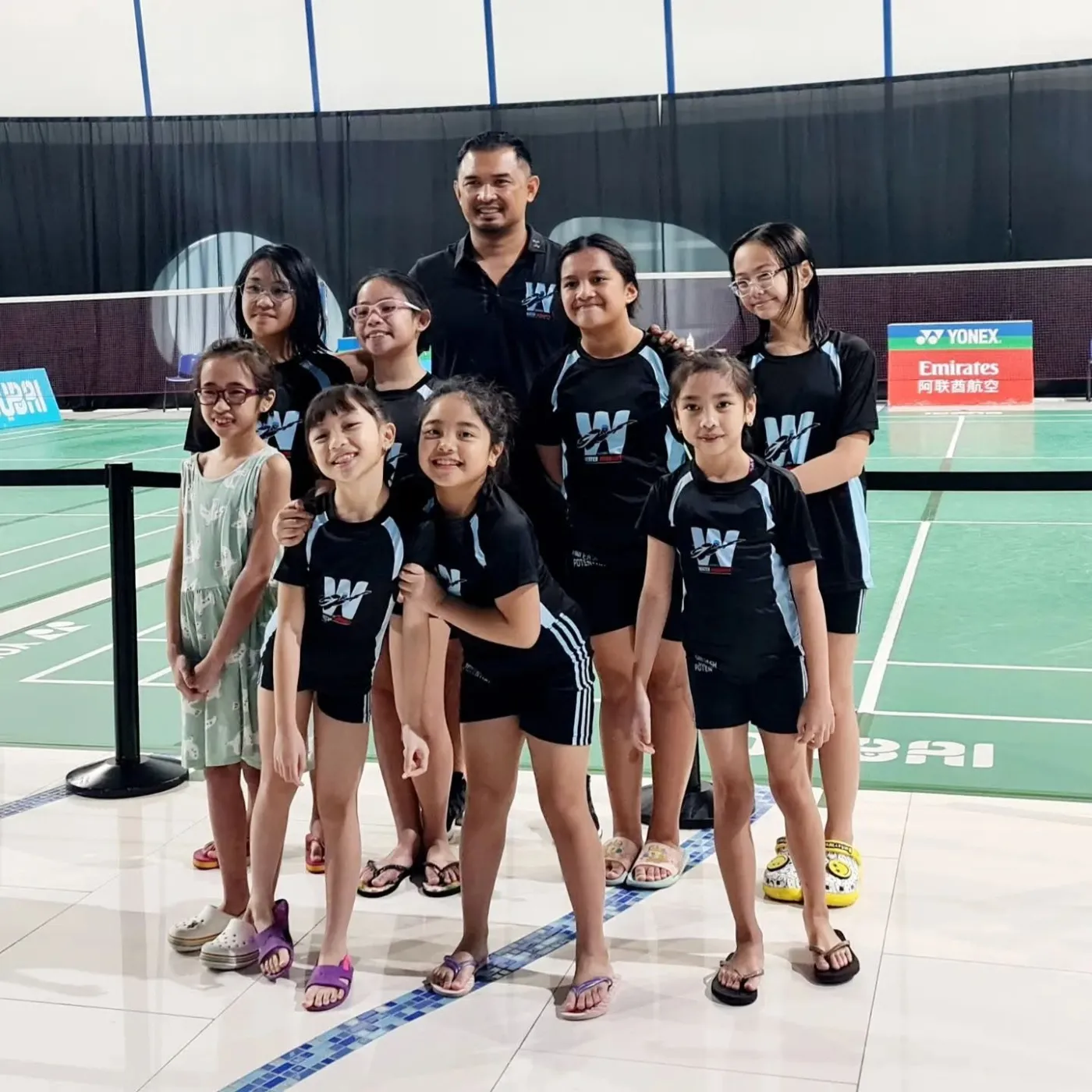 Young Water Warriors teammates gathered together in their club shirts